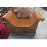 Modern stained hardwood window seat or bench with carved and pierced spindle back and shaped