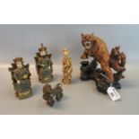 Mixed lot of wooden resin and brass oriental items to include; a carved wood study of a stylised