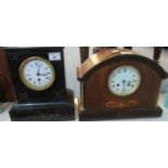 Early 20th Century black slate single train mantel clock with Roman enamel face, together with an