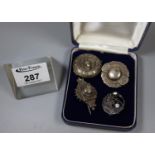 Four Victorian stamped brooches. Two unmarked.(B.P. 21% + VAT)