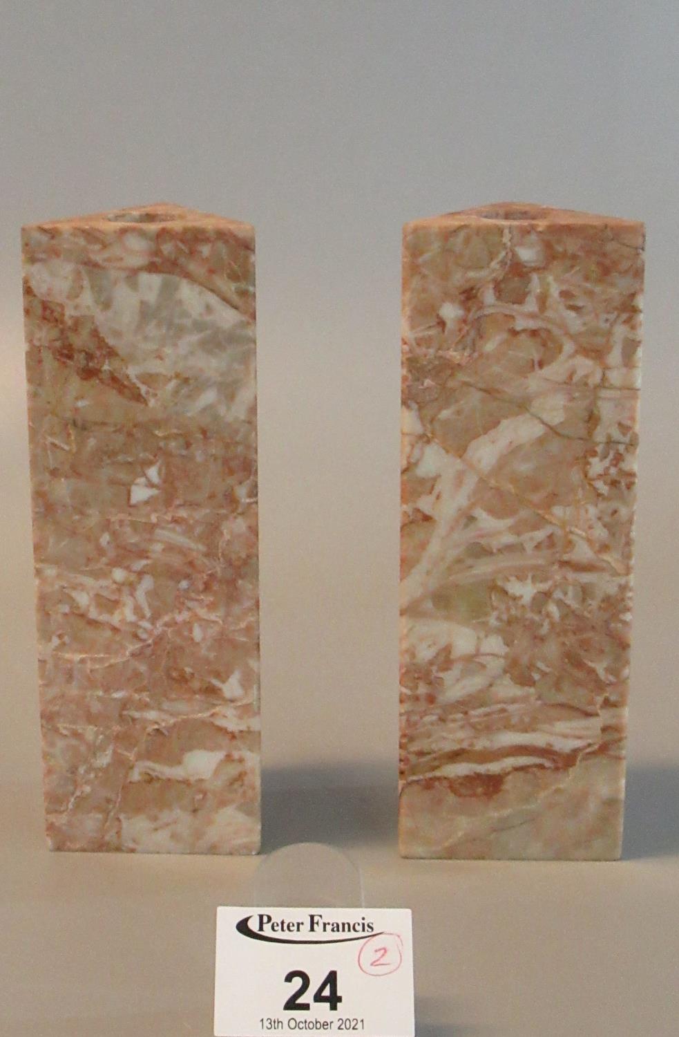 Pair of rouge marble Danese of Milan triangular section candlesticks. 14cm high approx. (2) (B.P.