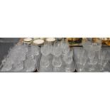 Three trays of modern cut glass and moulded glass good quality drinking glasses to include: whisky