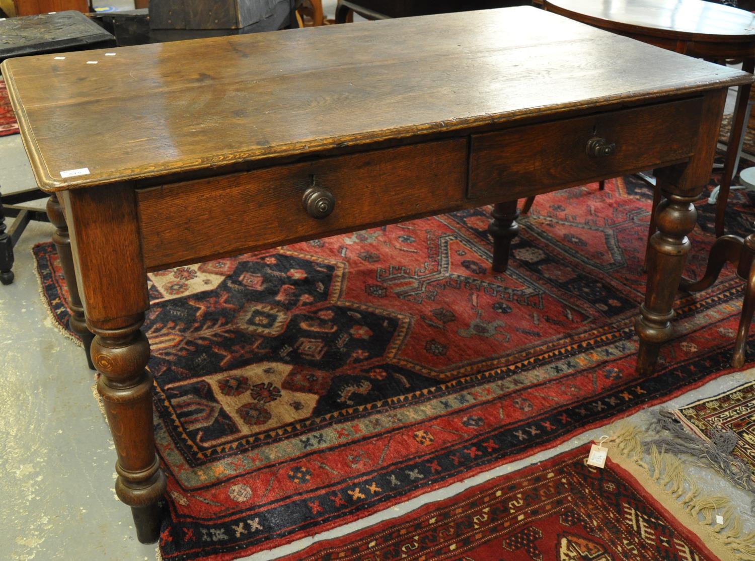 Late Victorian oak two-drawer farm house kitchen table on turned tapering legs. (B.P. 21% + VAT)