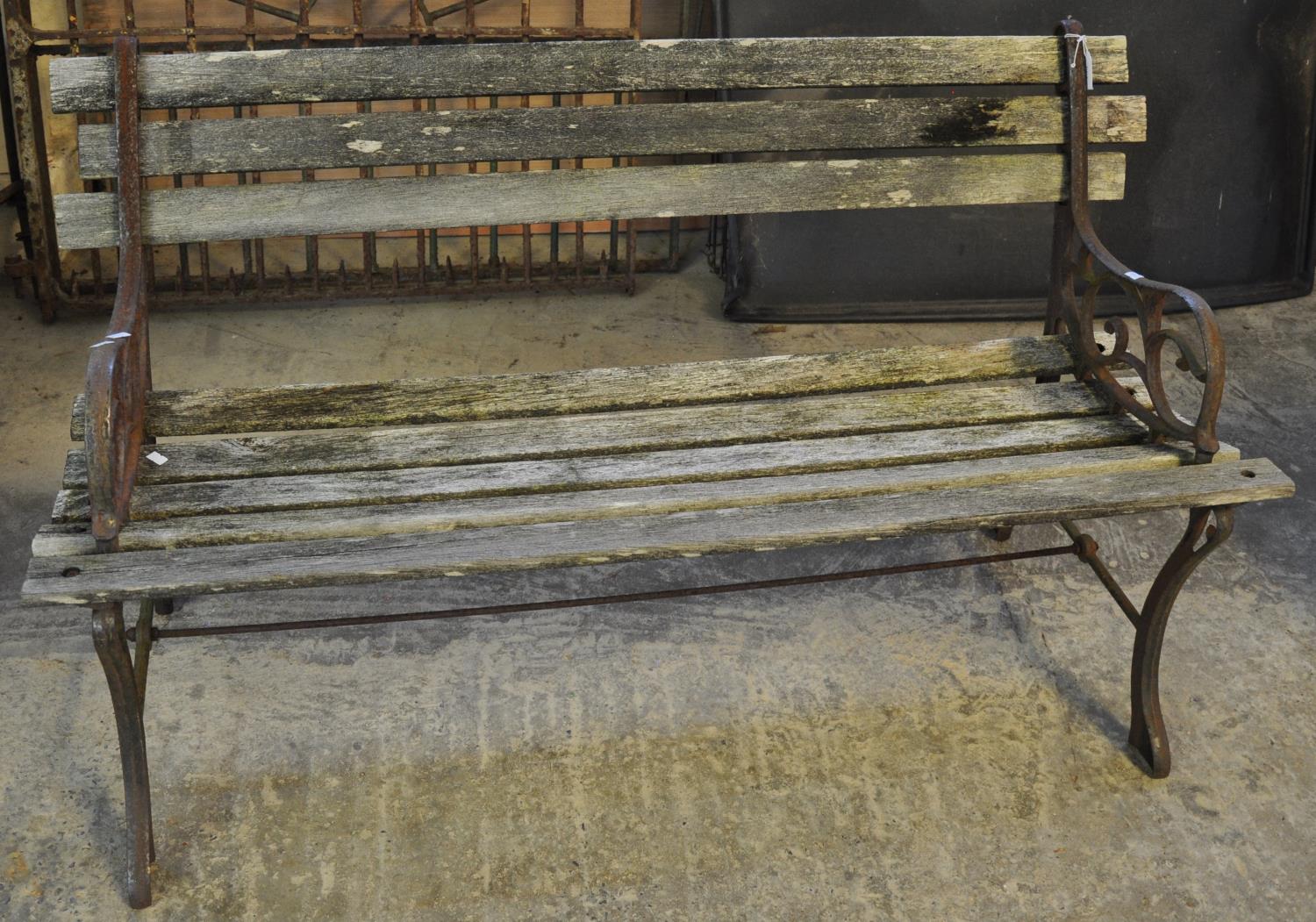 Weathered garden bench with metal ends. (B.P. 21% + VAT)