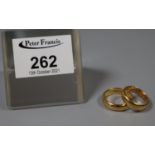 Two 22ct gold wedding rings. Ring size P and K. Approx weight 13.1 grams.