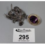 9ct gold and amethyst brooch and a silver and marcasite brooch.(B.P. 21% + VAT)