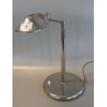 Mid Century chrome finish desk lamp on a circular base, appearing unmarked. (B.P. 21% + VAT)