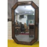 Early 20th century oak octagonal bevel plate mirror with moulded and beaded decoration. (B.P.