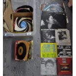 Box of assorted vinyl records to include; 45rpm singles including; John Travolta & Olivia Newton