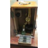 Early 20th Century brass students microscope in fitted wooden box with various slides including;