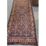 Deep brown ground Persian geometric and foliate runner, 260 x 110cm approx. (B.P. 21% + VAT)