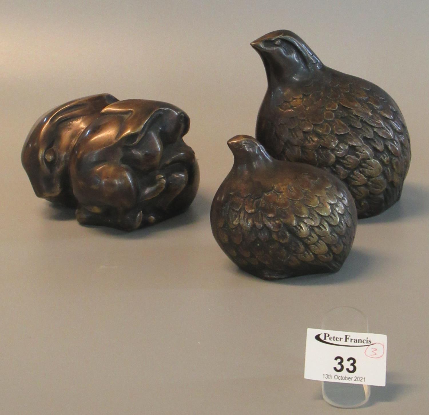 Three brass ornaments in the form of quail and rabbits. (3) (B.P. 21% + VAT)