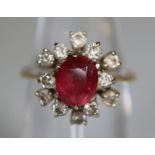 Ruby and diamond cluster ring. Ring size K&1/2. Approx weight 3.8 grams. (B.P. 21% + VAT)