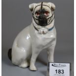 19th Century porcelain figure of a seated pug. (B.P. 21% + VAT)