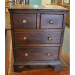 Victorian style hardwood miniature straight front chest of two short and two long drawers on bracket