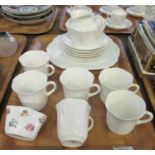 Shelley English fine bone china part teaset in scalloped floral design to include; teacups, milk