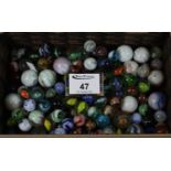 Small box of assorted coloured glass marbles, various. (B.P. 21% + VAT)