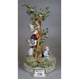 Von Schierholz porcelain figure group of children picking apples from a tree with a ladder on