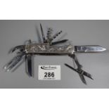 Unusual silver chased and steel Swiss style army knife marked Japan. (B.P. 21% + VAT)