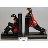 Pair of novelty pottery bookends in the form of oriental figures, one reading a book. (2) (B.P.