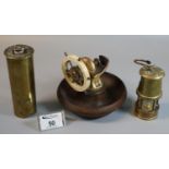 Ship's wheel type nutcracker with wooden dish base, together with miniature brass miner's safety