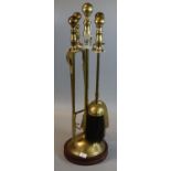 Brass companion stand with four fire irons including poker and brush. (B.P. 21% + VAT)