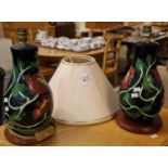 Pair of tube lined pottery/china baluster shaped table lamp bases with shades and wooden