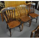 Set of three elm and beech slat back kitchen chairs on moulded seats and turned legs. (3) (B.P.