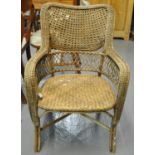 Modern rattan conservatory armchair by Oka. (B.P. 21% + VAT)