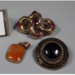 Two Victorian brooches and a carnelian pendant. (B.P. 21% + VAT)