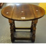 Titchmarsh and Goodwin oak drop leaf table of small proportions. (B.P. 21% + VAT)