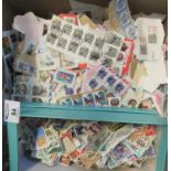 Large box of all world stamps on paper (no British) and small box of off paper stamps, many 100s. (