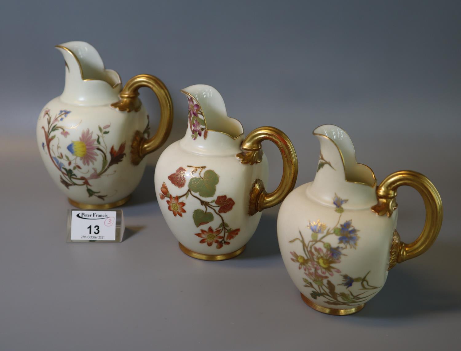 Three similar Royal Worcester blush ivory flat back jugs, all with shape no. 1094. (3) (B.P. 21% +