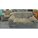 Modern two seater sofa bed with matching armchair. (B.P. 21% + VAT)