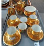 Royal Worcester gold coloured coffee set comprising: coffee pot, milk jug and sugar basin with six