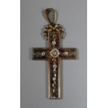A large Victorian silver gilt cross pendant decorated with applied flowers and foliage with