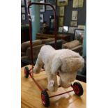 Triang push along child's dog on four wheels. (B.P. 21% + VAT)