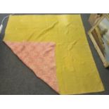 Vintage cotton quilt, one side floral design on a pink ground and the other plain mustard ground. (
