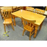 Modern beech kitchen table on baluster turned legs, together with a set of four beech slat and curve