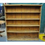 Probably early 20th Century rustic pine free standing open bookcase having four fitted shelves,