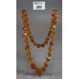 One graduated string of Modern Amber beads. (B.P. 21% + VAT)