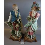 Pair of Austrian style china figures of a young gallant and his lady ,on shaped naturalistic bases