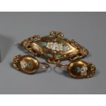 18ct gold brooch and earrings decorated with enamel flowers. French marks to earrings. Approx weight