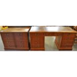 Reproduction yew wood knee hole desk having leather inset top above three drawers to each pedestal