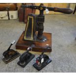 Late Victorian cast iron table top seal by Wyon of London on a mahogany base with turned handle,