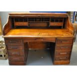 Early 20th Century oak 'S' roll top tambour pedestal desk, with lock plate marked 'Derby desk Thomas