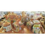 Three trays of pottery cottage design items comprising: teapots, milk jugs, water jug, biscuit