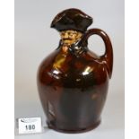 Royal Doulton brown glazed series ware single handled decanter modelled as an old man with moulded
