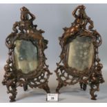 Pair of oxidised metal mirror or photograph frames in Rococo style with figure mounts. 32cm high