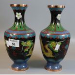 Pair of Chinese black ground cloisonne baluster shaped vases depicting dragons chasing flaming